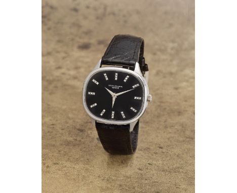 Patek Philippe. A very rare unusual and fine 18K white gold diamond set manual wind wristwatch with dual time zone hand and s