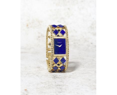 Patek Philippe. A fine and rare lady's 18K gold and lapis lazuli manual wind bracelet watchReference: 4241/906Date: Manufactu