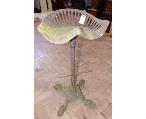 Cast iron tractor seat high stool. Condition report: see terms and conditions