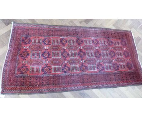 Persian red ground carpet 184 x 88cm. Condition report: see terms and conditions