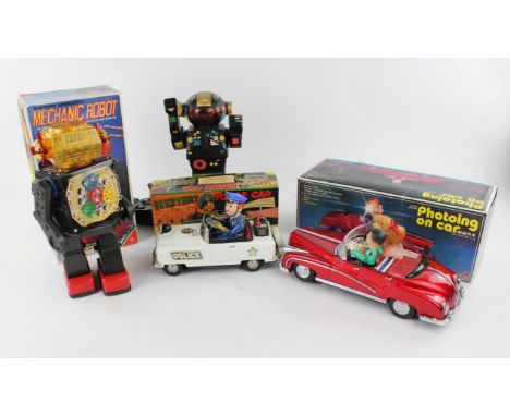 A vintage Japanese tinplate 'Mechanic Robot', boxed, another Chinese robot, a Chinese tinplate 'Photoing on Car', boxed and o