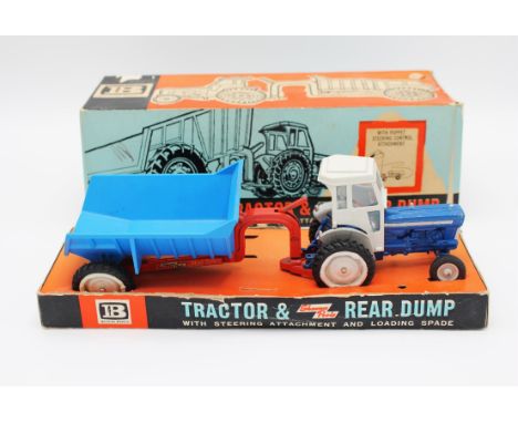A Britain's No.9630 Shawnee Poole tractor and rear dump, comprising a blue & grey tractor with matching red and blue trailer,