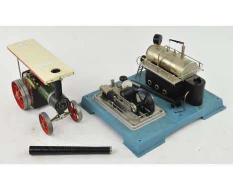 A Wilesco D18 table top steam engine and a Mamod steam Tractor.  (2)Condition Report:  The Mamod engine has no box, steering 