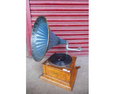A vintage oak Curry's gramophone, with metal horn speaker 