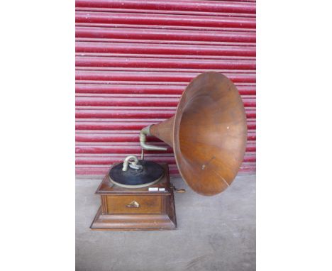 A vintage oak HMV gramophone, with oak horn speaker