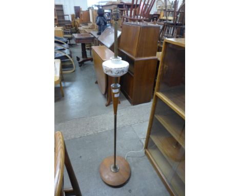 A teak standard lamp 