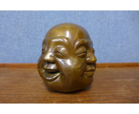 An oriental bronze four faced Buddha, 12cms h 
