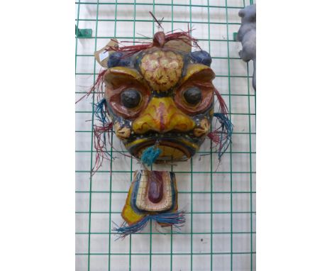 A Chinese corkwork table lamp and a papier mache face mask 