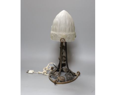 A French 1920's Edgar Brandt style wrought iron table lamp, with frosted glass shade,38.5 cms high,