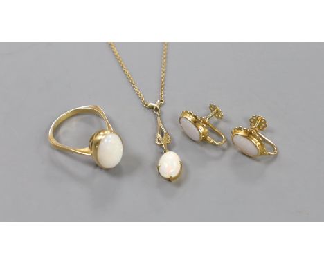 A 750 yellow metal and oval cabochon white opal set ring, size U/V, gross weight 6.2 grams, together with a pair of yellow me
