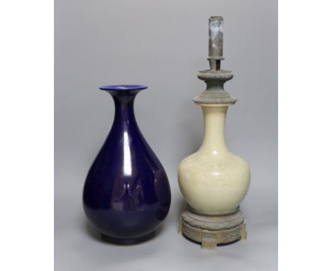 A Chinese blue glazed vase, Yongzheng mark to base but later and a Chinese crackle glazed vase converted to a lamp, total hei