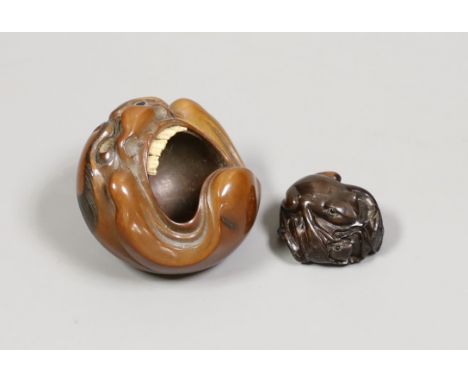 A Japanese mask nut carving wood carving, Meiji period and a netsuke of frogs, marks to bases, largest 7.5cm wide Ivory submi