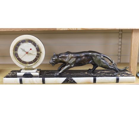 An Deco spelter and marble panther mantel clock on plinth base, 80cm wide