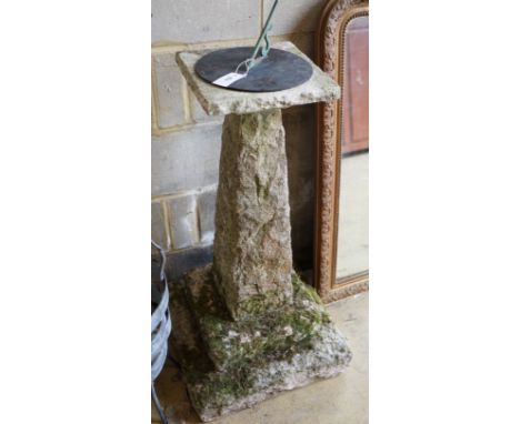 A carved stone sundial with brass dial and gnomon, height 105cm