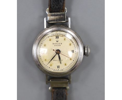 A lady's 1940's stainless steel Rolex Oyster Precision manual wind wrist watch, on associated strap, case diameter 24mm.