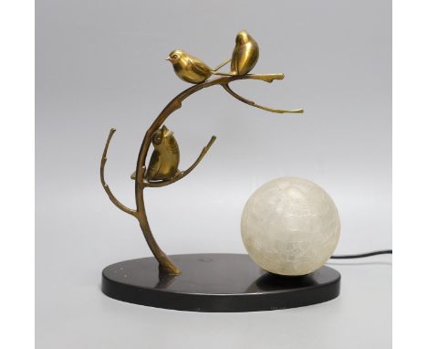 A French 1930's bronze lamp of stylistic birds in a tree, with a frosted globe shade on a black marble base,27 cms high,