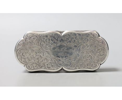 A Victorian engraved silver shaped oval snuff box, by Nathaniel Mills, Birmingham, 1840, with later engraved inscription, 95m