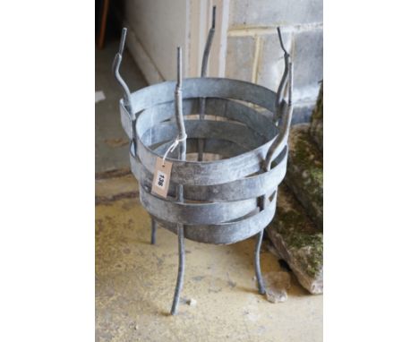 A circular wrought iron planter, height 58cm