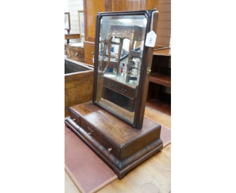 An 18th century mahogany box based toilet mirror, with bevelled plate and three base drawers, on bracket feet, width 49cm, de