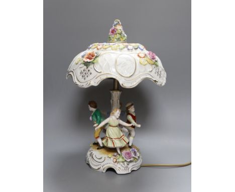 A German porcelain figural lamp with lithophane shade, 40cm
