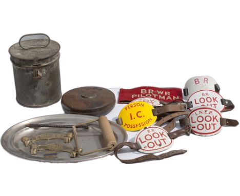 A selection of items to include: x6 enamel armbands (x1 LNER), a leather cased GWR tape measure, LMS detonator tin, x2 toilet