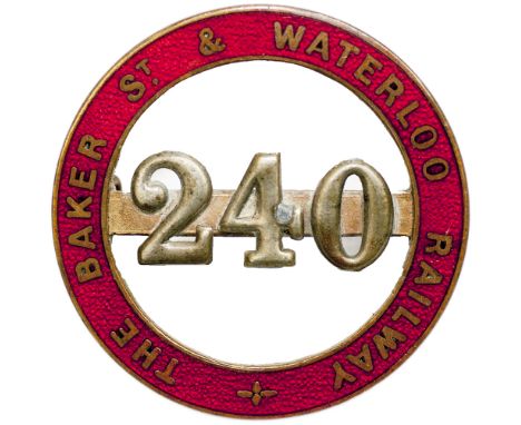 The Baker St. and Waterloo Railway enamel Cap Badge number 240. Brass with red enamel back marked J R Gaunt Bham. In excellen