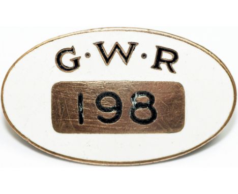 GWR enamel Cap Badge number 198, by J.A. Wylie & Co London. White enamel ground has the initials in black & gold at the top a