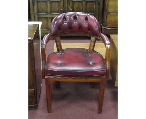 An Oxblood Leather Office Open Armchair, with button low back, top rail and seat.Width of chair at widest point (arm to arm) 