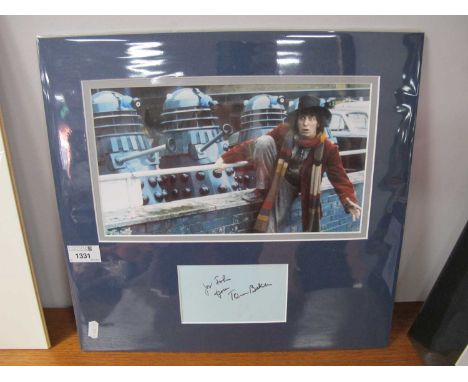 Dr Who. Tom Baker Autograph, black pen signed (unverified) on light blue paper, with image, as an unframed montage, overall 3