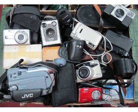 A collection of cameras and lenses from makers such as Chinon, Tamron, LUMIX, Brownie, Cosmic, JVC camcorder and various bino