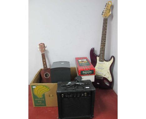 An Encore electric base guitar, Bose companion 3 series II speaker, Dispaly4Top guitar amp, ukulele and boxed bagpipe. (5)