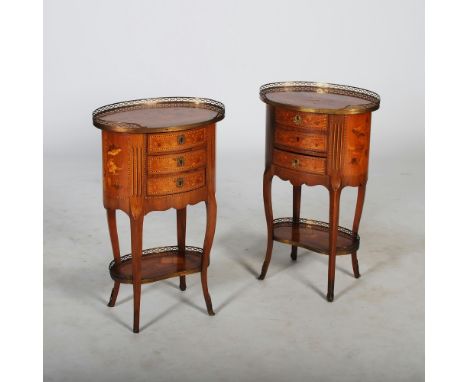 A pair of late 19th century French walnut, marquetry and gilt metal mounted occasional tables, the oval shaped tops inlaid wi