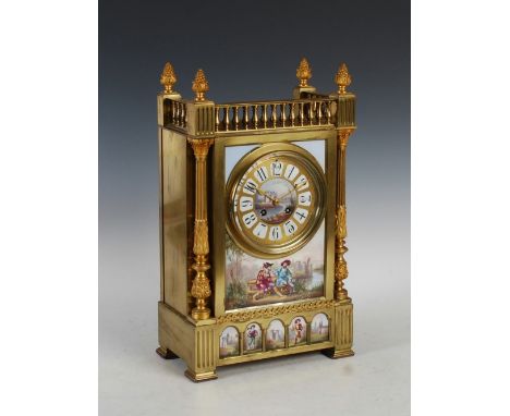 A late 19th century French gilt metal and porcelain mounted mantle clock, the circular dial with Arabic numeral panels and tw