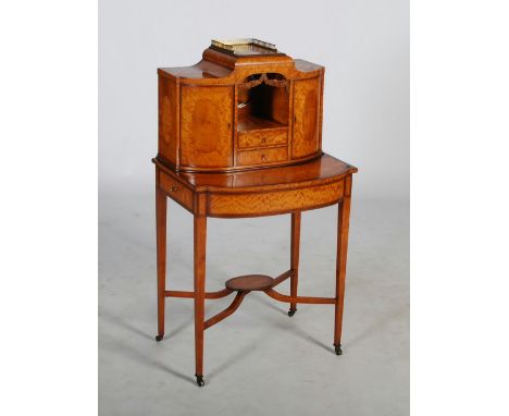 An early 20th century satinwood and boxwood lined bonheur-de-jour, the rectangular top with pierced gilt metal three quarter 