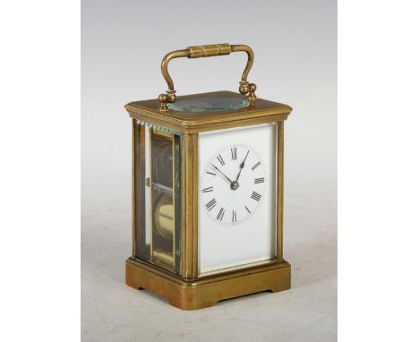 An early 20th century French striking carriage clock, the circular enamel dial with Roman numerals, the platform escapement w