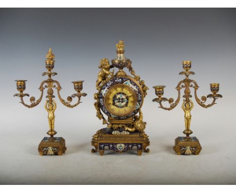 A late 19th century French ormolu and champleve enamel clock garniture, the clock with a circular dial inscribed '..BAILLY A 