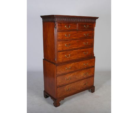 A George III mahogany chest on chest, the moulded cornice and arcaded frieze above two short and three long graduated cockbea