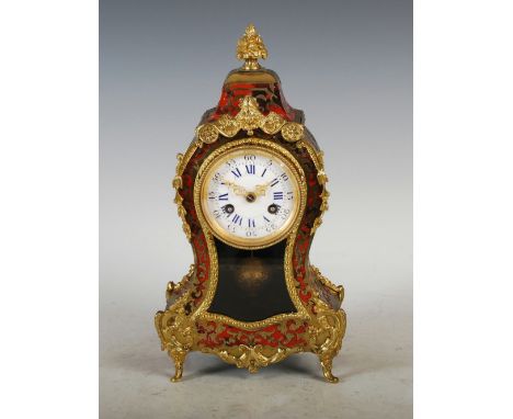 A 19th century French Boulle mantle clock, the circular dial with Arabic and Roman numerals, the twin train movement striking