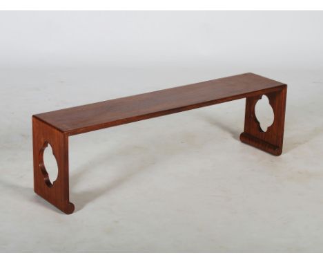 A Chinese dark wood bench, 20th century, of plain rectangular form with pierced quartrefoil trestle ends and inverted scroll 