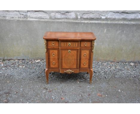 A late 19th century Louis XVI Transitional style kingwood, marquetry and gilt metal mounted breakfront commode, fitted with t