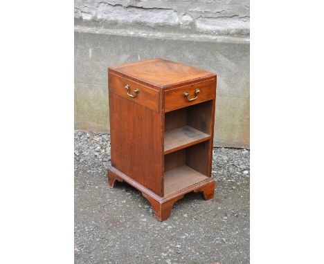 A George III style mahogany pedestal bookcase, the rectangular top above four blind frieze drawers and two open recesses, rai