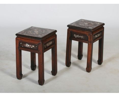 A pair of Chinese dark wood and mother-of-pearl inlaid jardiniere stands, late 19th/ early 20th century, the square shaped to