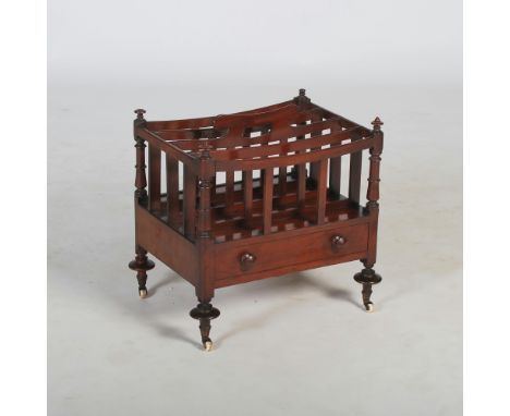 A 19th century mahogany Canterbury, of rectangular form with four divisions above a single drawer, raised on tapered cylindri