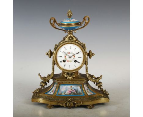 A late 19th century French gilt metal and porcelain mounted mantle clock, the circular porcelain dial with Roman numerals, Sl