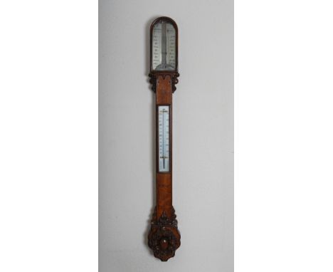 A Victorian oak stick barometer, H.Huges, 59 Fenchurch St. London, with silvered dial and adjustable vernier, the trunk with 