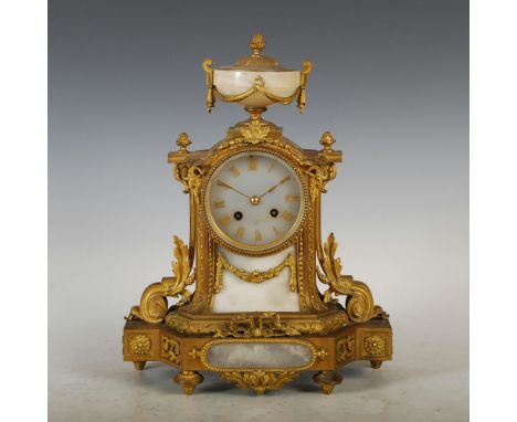 A late 19th century French ormolu and marble mantle clock, the circular dial inscribed PARIS, with Roman numerals and twin tr