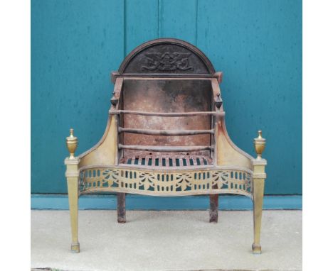 A 19th century brass and cast iron fire basket in the George III style, the serpentine basket fronted by two horizontal bars 