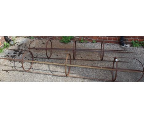 Two large weathered metal garden obelisks (one with missing finial)