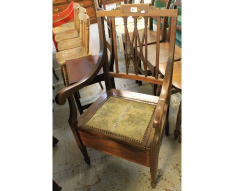 Edwardian mahogany inlaid commode armchair.