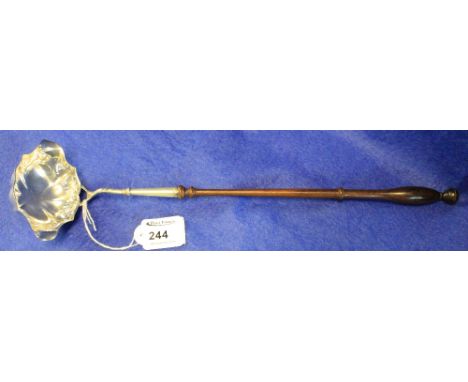 Silver toddy ladle with turned wooden handle, London, 1977.